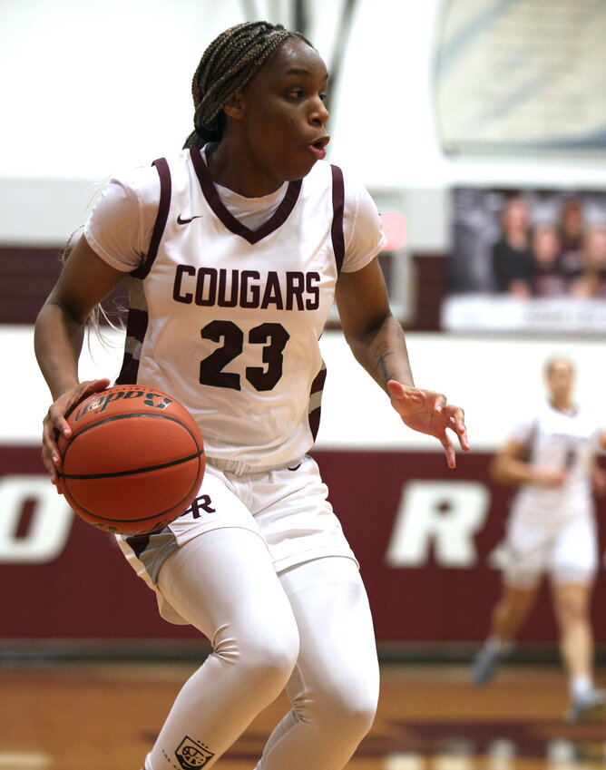 Aniya Foy dribbles up the court during Tuesday&rsquo;s District 19-6A game between Cinco Ranch and Seven Lakes at Cinco Ranch High School.