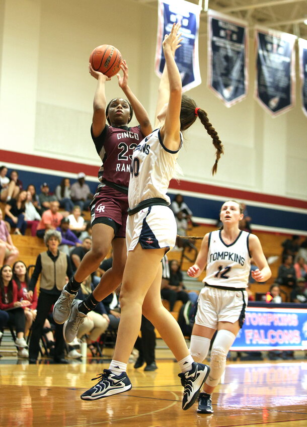 Aniya Foy shoots over Natalie Kitts during Monday&rsquo;s game between Cinco Ranch and Tompkins at the Tompkins gym.