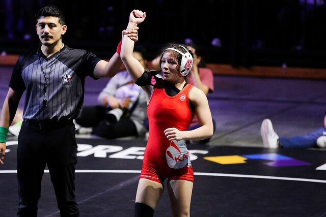 Emily Beltran (right) of Katy High School is declared the state 6A wrestling champion for her weight class after defeating her opponent in a match at the Berry Center in Cypress.