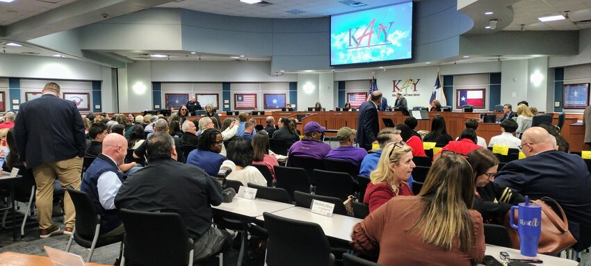 Controversy over proposed changes to Katy ISD&rsquo;s policy for the naming of new schools drew a capacity crowd at Monday night&rsquo;s meeting of the board of trustees. Several people wore red in support of recent namesake James Cross, whose decision to run for school board prompted some board members to call for changes to the existing policy.