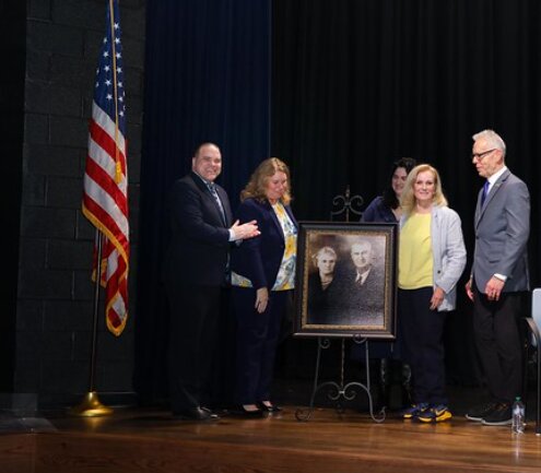 (Left to right) Katy ISD Superintendent Ken Gregorski, Freeman High Principal Gina Cobb, educator Lynn Freeman, Freeman family representative Carla Freeman Mattingly, and KISD Board of Trustees President Victor Perez unveil the portrait of Freeman family founders during the March 3 dedication at the new campus at 7800 Katy Hockley Road in Katy.
