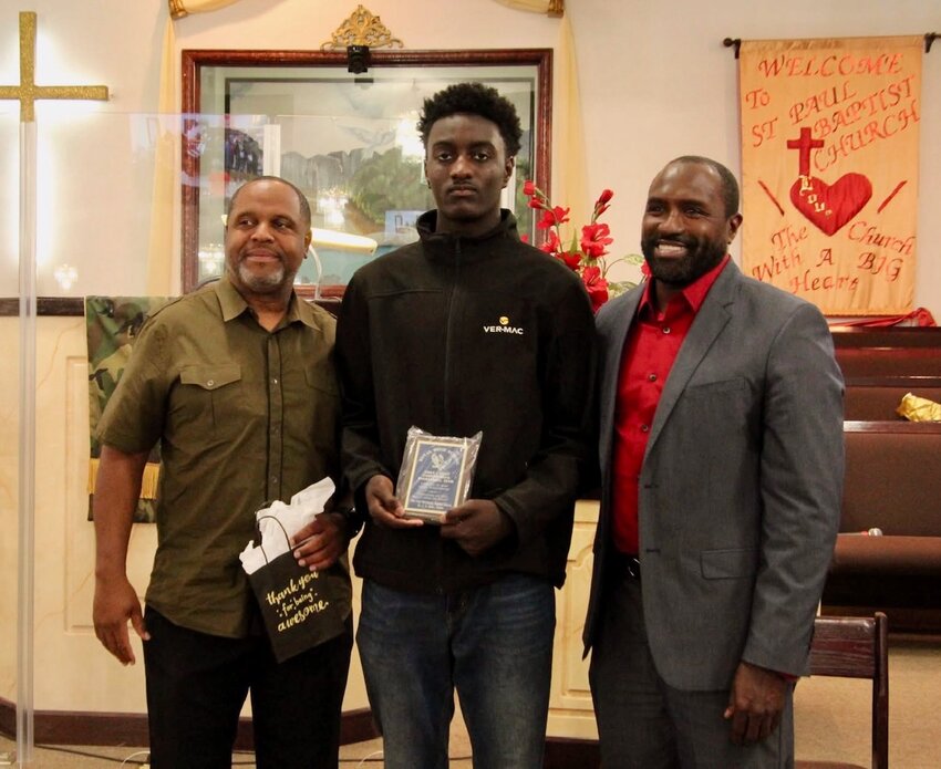 At the March 16 Heritage Celebration at St. Paul Missionary Baptist Church at 1335 Waller Avenue in Brookshire, area coaches and athletes were honored with special awards. Left to right: Howard Randle, Royal boys varsity basketball coac; student Elijah Matthews, and Royal Head Coach/Athletic Coordinator Theadis Reagins received recognition during the evening. The Royal varsity boys basketball team and the Royal varsity girls basketball team, along with the Royal High School Marching Sound Machine Band, were also saluted at the event hosted by Rev. Dr. Lee Jones at the church.