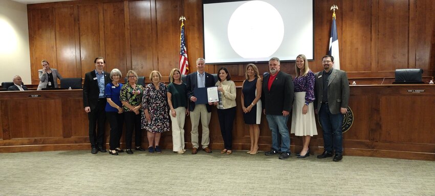 City council members stand with representatives from Keep Katy Beautiful as Mayor Dusty Thiele (center) presents special recognition to the group for their recent awards from Keep America Beautiful and Keep Texas Beautiful.