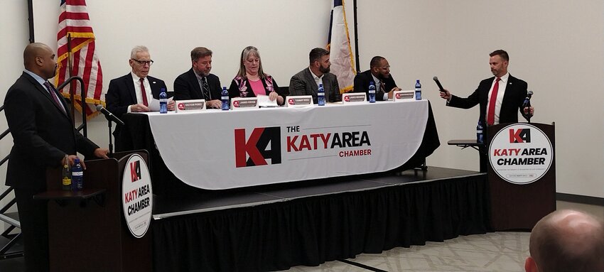 Left to right: Robert Long of the Texas Association of School Boards and school board candidates Victor Perez (incumbent in Position1), James Cross (challenger in Position 1), Tammy Reed (challenger in Position 2), Lance Redmon (incumbent in Position 2) and Khris Fields (challenger in Position 2) listen as moderator Jason Burdine poses a question during the March 18 candidate forum sponsored by the Katy Area Chamber of Commerce. About 100 people attended the event, held at the Legacy Stadium community room at 1830 Katyland Drive in Katy.
