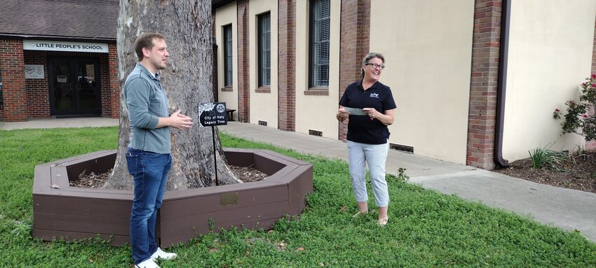 Mark Kimbrough (left), senior pastor of Katy&rsquo;s First United Methodist Church, listens attentively as Lynn Paulsen, representing Keep Katy Beautiful, dedicates a &ldquo;legacy tree&rdquo; outside the church&rsquo;s fellowship hall at Fifth Street and Avenue B in Katy on April 2.