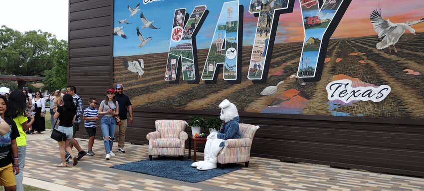 A family waits to have their photo taken with the Easter Bunny during the second Katy Exchange event held April 19 in Katy historic downtown square.