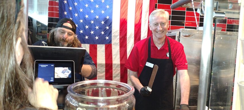 City of Katy Mayor Dusty Thiele is all smiles as he serves up barbecue while acting as the celebrity chef at Brett&rsquo;s BBQ, 25220 Kingsland, on May 1. A portion of the proceeds from restaurant sales during Thiele&rsquo;s time behind the counter will be donated to HerWell, a Brookshire-based nonprofit which guides survivors of unhealthy sexual relationships and family violence to break free from the fear of their past and step into healing&mdash;mentally, physically, and spiritually -- through personalized 12-month programs.