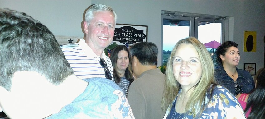 Incumbent Mayor Dusty Thiele (left)celebrates election results with constituent Diane Robichaux Walker (right) at the election results watch party at Brett&rsquo;s BBQ, 25220 Kingsland in Katy, on May 3.