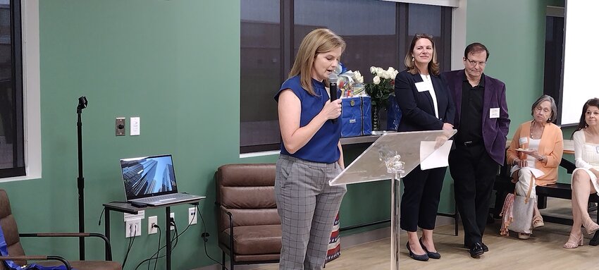 Host Raimie Hodges of Edward Jones (left) new director for member engagement for the Texas Christian Chamber of Commerce, welcomes attendees to the organization&rsquo;s kick-off event at the Katy Gardens co-working space, 1040 Schlipf Road in Katy, on May 8, as Chamber President Erica Scardino (center) and Chairman of the Board Paul Kurt await their turns to speak. The group, previously known as the Katy Christian Chamber of Commerce, announced their statewide expansion earlier in May.