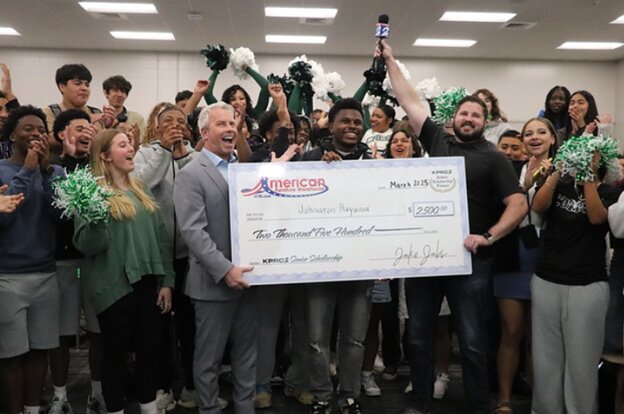 Mayde Creek High School student Johnaton Haywood receives a $2,500.00 scholarship from KPRC and American Furniture Warehouse in a surprise ceremony at the campus on June 4.