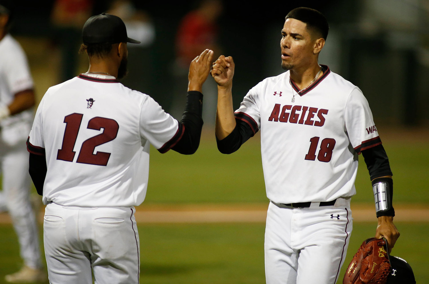 Relief pitcher Ian Mejia and starting pitcher Chris Jefferson celebrate the Aggies’ 7-5 win over Seattle U Wednesday night in Mesa, Arizona.