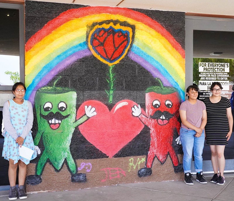 “The Happiness of New Mexico and Our Creativity” was painted by left to right, mural artists and sisters Reyna Arias, Jessica Arias and Gabriela Arias.