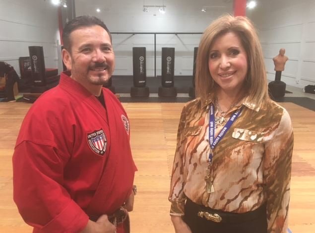 Master Sensei Eli Guzman, owner of Guzman Martial Arts, looks over his new dojo with Mesilla Valley Mall General Manager Loretta Pina.