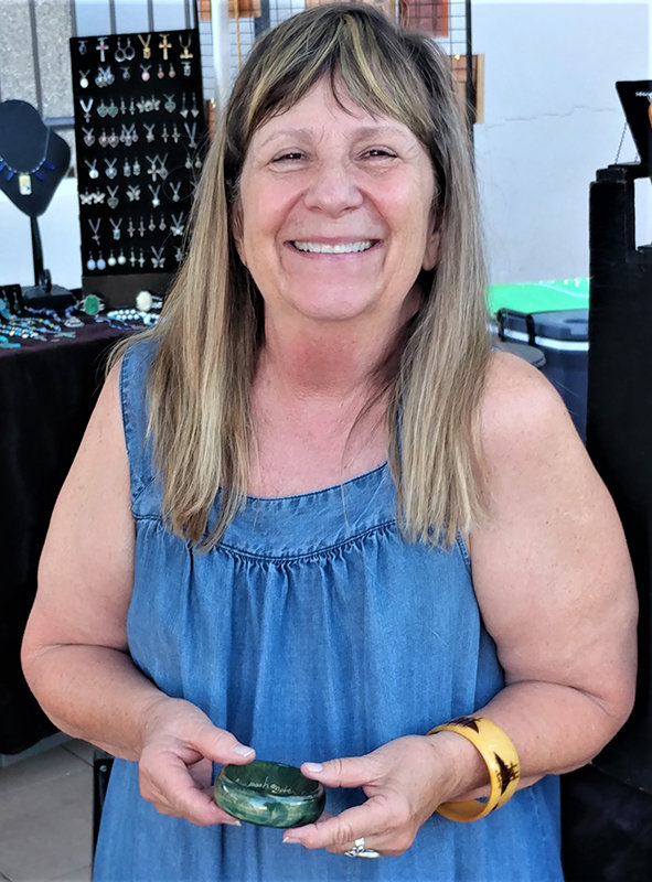 Marcella Huppke at her Uniquely Chic Jewelry & Accessories booth at the Farmers and Crafts Market of Las Cruces.