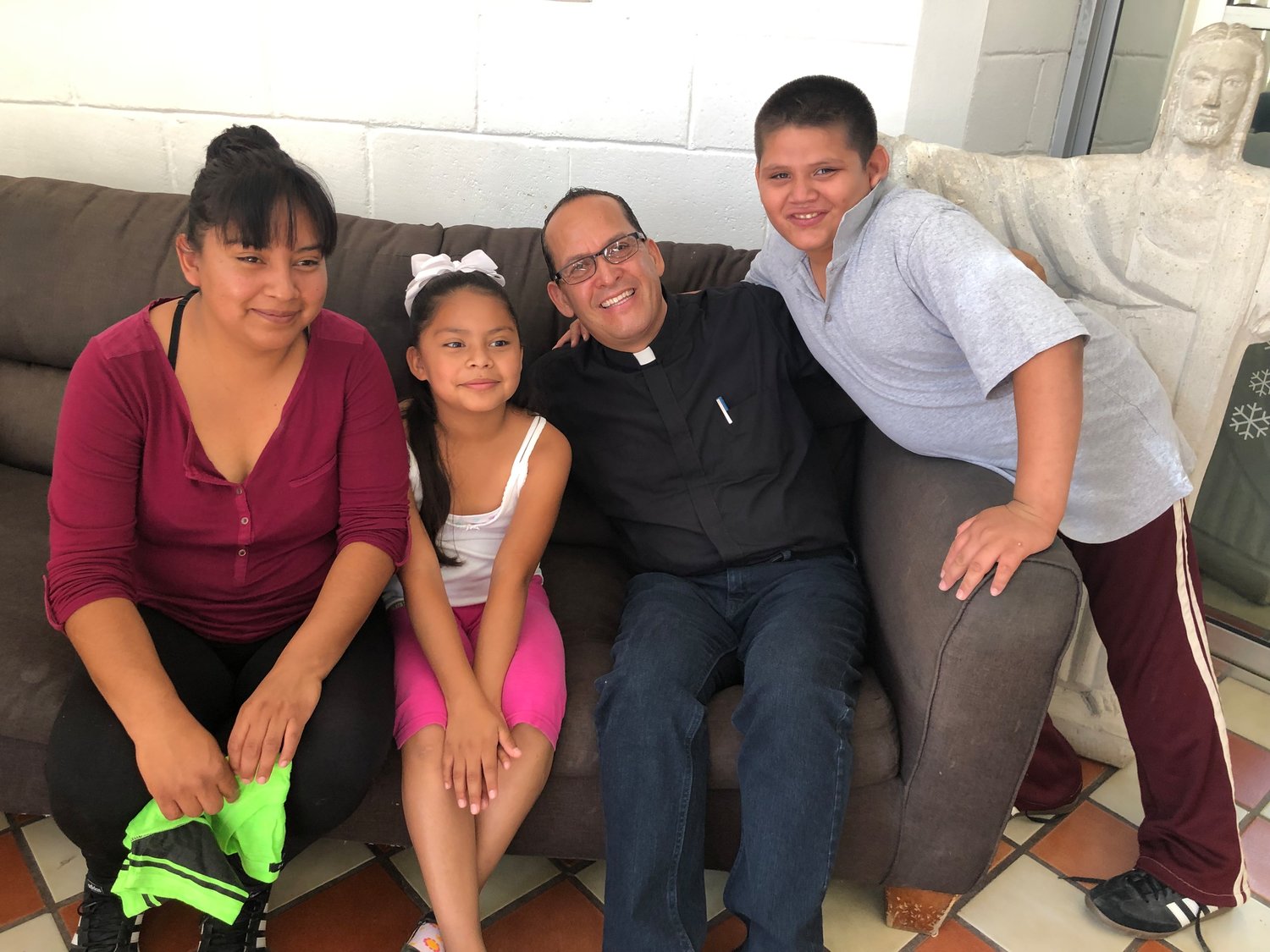 adre Javier Calvillo with family fromHonduras at La Casa del Migrante