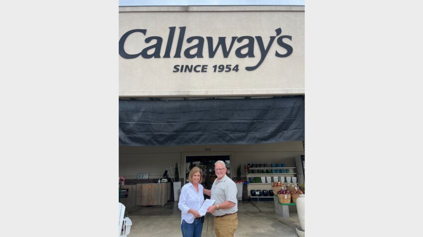 Mark Doiron and Sandra Boyd, a Callway employee. Doiron was in Gluckstadt passing out flyers about the Rotary interest meeting held Tuesday at St. Joseph.