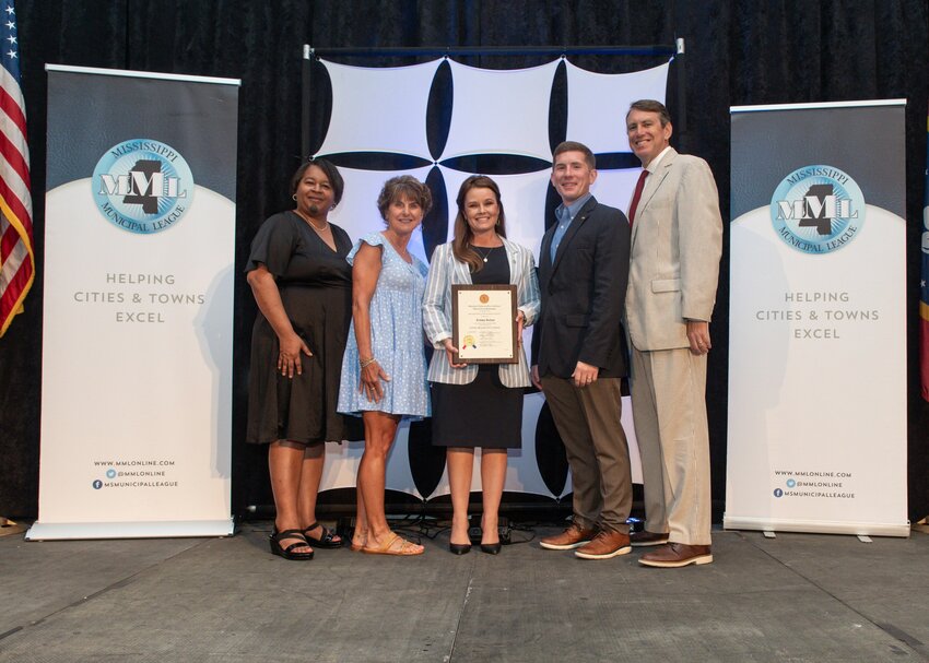 Municipal Clerk Lindsay Kellum, center, completed the Certified Municipal Clerk program on June 25 at the Mississippi Municipal League conference in Biloxi. Pictured left to right: Kimberly Vaughn, Certification Chairman, Suzett Davis, president of the Mississippi Municipal Clerk’s and Collectors Association, Lindsay Kellum, Jason Camp, Extension Specialist of the Center for Government and Community Development, and Sumner Davis GCD Center Head.