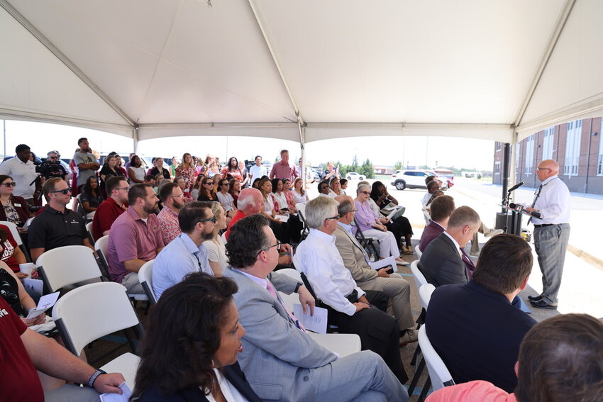 Madison County Schools Superintendent Ted Poore addressing the crowd of faculty, district administrators, community members, parents, and students gathered to celebrate the ribbon cutting of new classrooms at Germantown High School