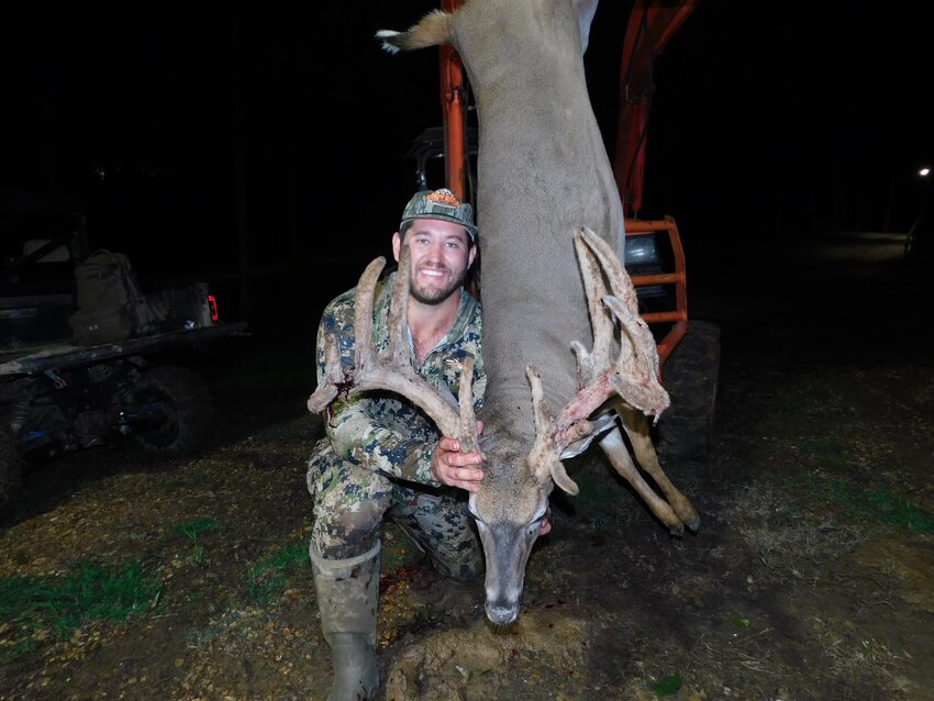 Pat Seabrook shows off the 14-point buck he harvested last month near Raymond.