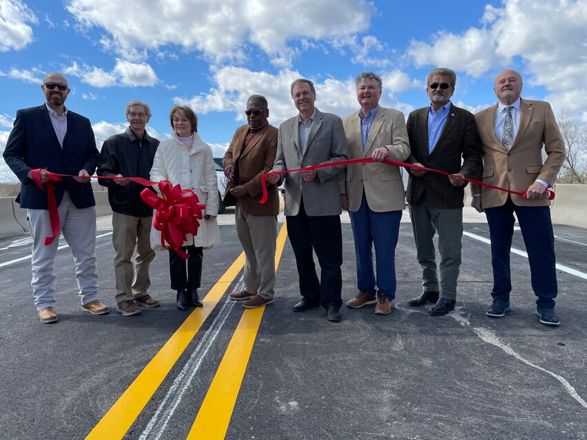 State and county officials gathered Wednesday for a ribbon-cutting ceremony to commemorate the opening of Reunion Parkway.