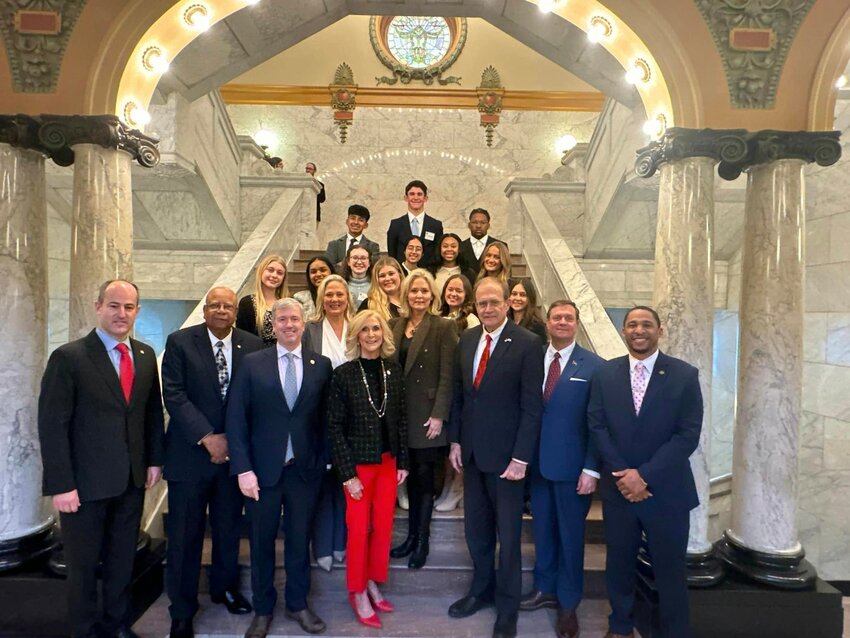Pictured, front row from left, are Rep. Clay Mansell, Senator Joseph Thomas, State Treasurer David McRae, Attorney General Lynn Fitch, Lt. Governor Delbert Hosemann, Senator Walter Michel, Senator Bradford Blackmon (Second row) Rep. Celeste Hurst, Rep. Jill Ford (Third row) Mackenzie Turner, Canton Academy: Pranavi Buddala, MCHS; Mary Lamar Chustz, Jackson Academy; Christy Rutledge, Jackson Prep; Adelaide Jacobs, MRA (Fourth row) Katie Lancaster, St. Joe; Kashvi Sukhadia, RHS; Avonna Mendenhall, GHS;  Mae Moses, Tri-County (Back) Giancarlo Rosales, CHS; John William Walker, St. Andrews; Jovun Ray , VJHS