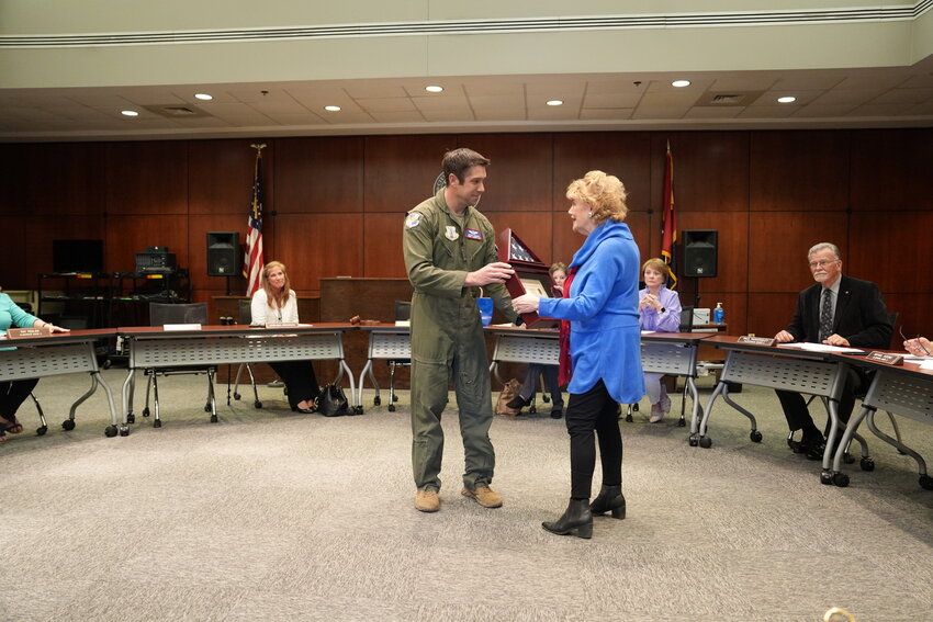 Master Sergeant Joshua Heeren presented Mayor Mary Hawkins Butler and the City of Madison with a flag flown at Al Udeid AirBase, Qatar while Heeren was deployed in support of Operation Inherent Resolve and Operation Spartan Shield.