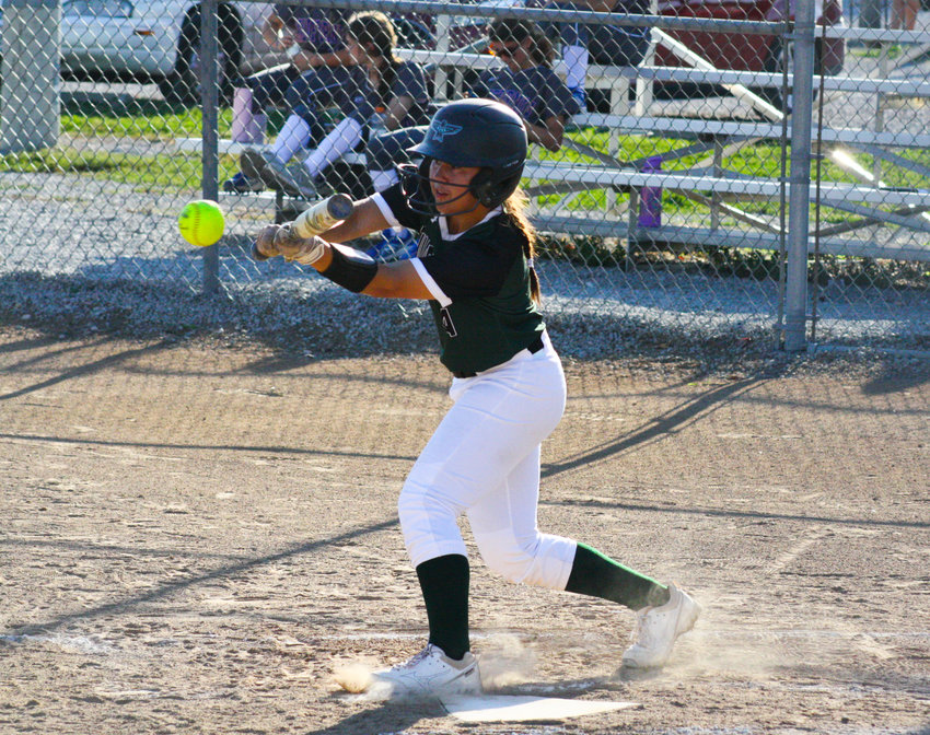 North Callaway junior outfielder Corynne Miller bunts a single Tuesday in the Ladybirds' 7-2 win against California in Auxvasse.