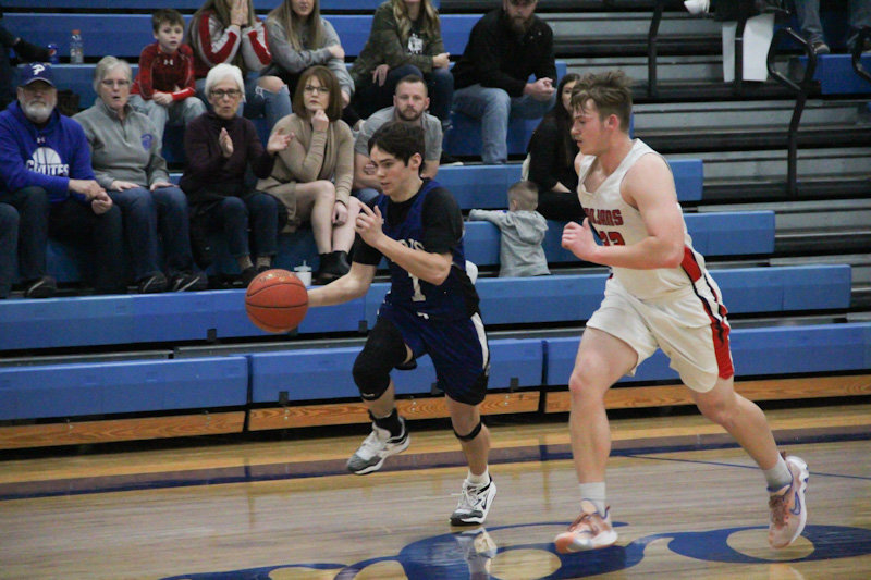 Paris senior Colton Kendrick speeds down the court Jan. 28 against Community R-6.