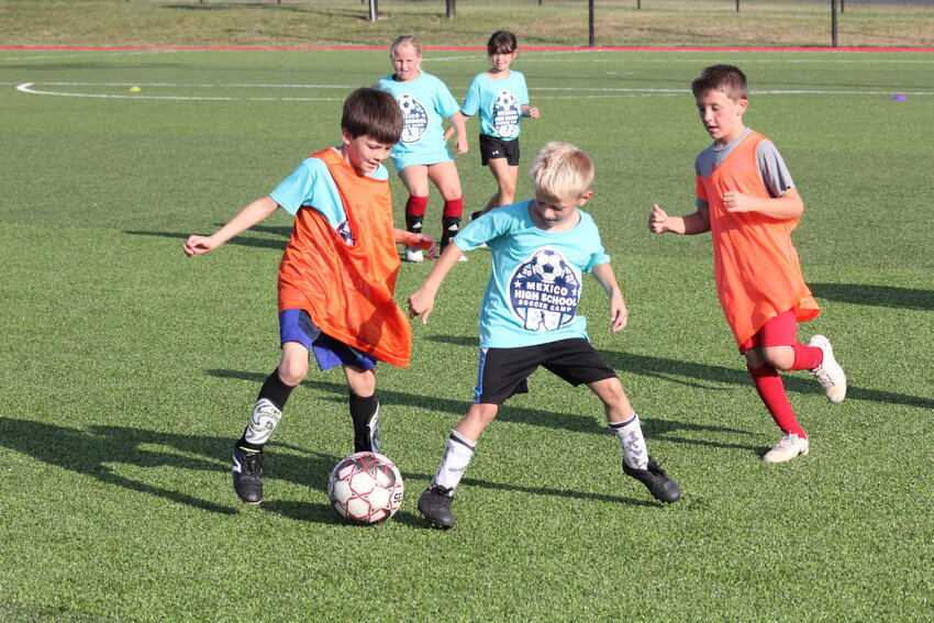 Area youth participate in a scrimmage during Mexico High School's summer soccer camp held last week at Chris Hotop Field. It was the school's first camp in a while as coaches Bill Gleeson and Sarah Olson said it hasn't been a thing since they've been at the school.