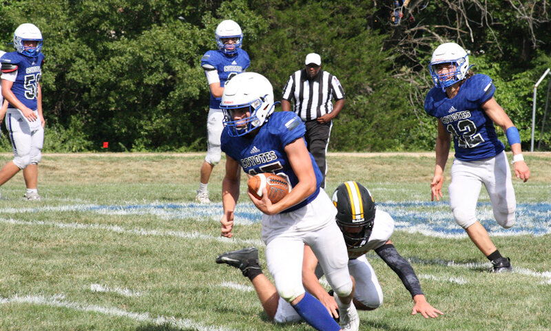 Paris senior Colton Kendrick breaks a tackle against Grandview last season.