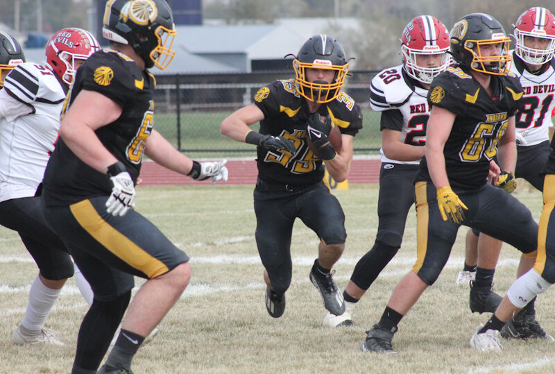 Van-Far senior Gage Gibson runs through a hole this season.