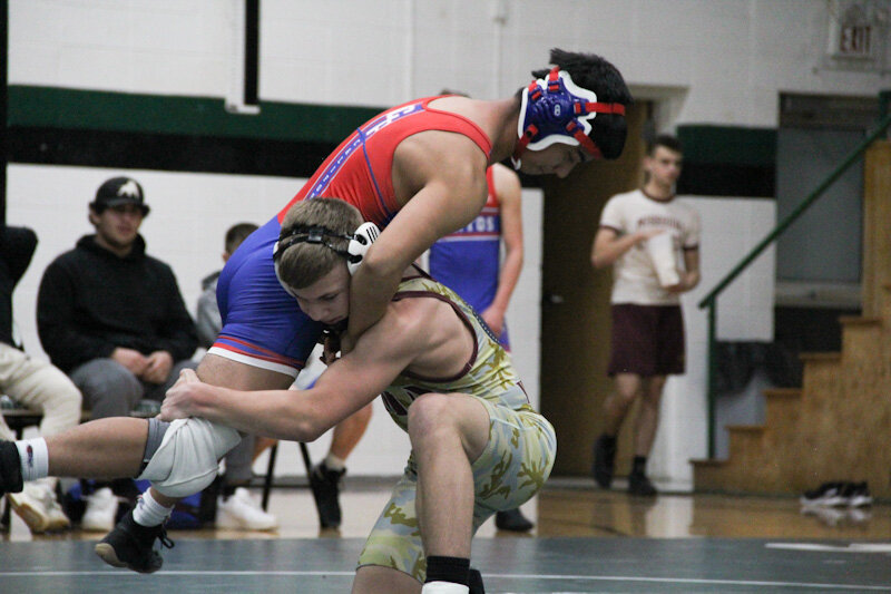 Missouri Military Academy sophomore Sam Stevens wraps up an opponent last season.