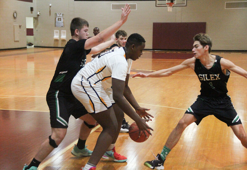 Missouri Military Academy junior Gihana Favour Nziza handles the ball in the post against Silex on Monday at home in Mexico. The Colonels lost this game and the next night at home against Christian, when Nziza had 18 points.
