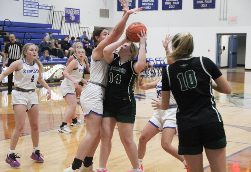 North Callaway junior Faith Cash muscles a shot over a Sturgeon defender on Thursday afternoon in Sturgeon.
