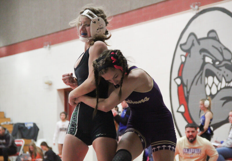 North Callaway sophomore Brooke Giboney attempts to escape from Hallsville's Candace Calvert on Monday at the Mexico Brick City Classic at the Mexico Sports Complex.