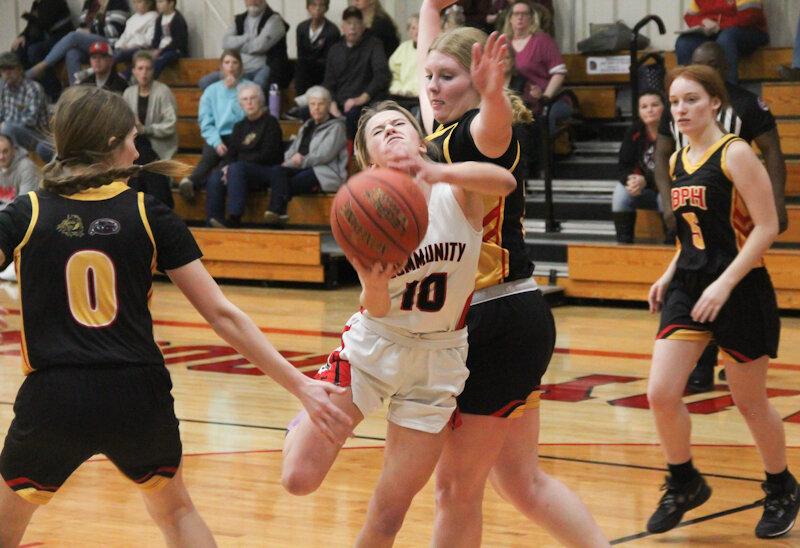 Community R-6 senior Alyssa Beamer is fouled as she shoots against Bunceton/Prairie Home on Monday at home in Laddonia.