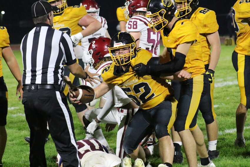 Van-Far senior Dalton Hays emerges from a pile with the recovered fumble against Louisiana on Friday at home in Vandalia.