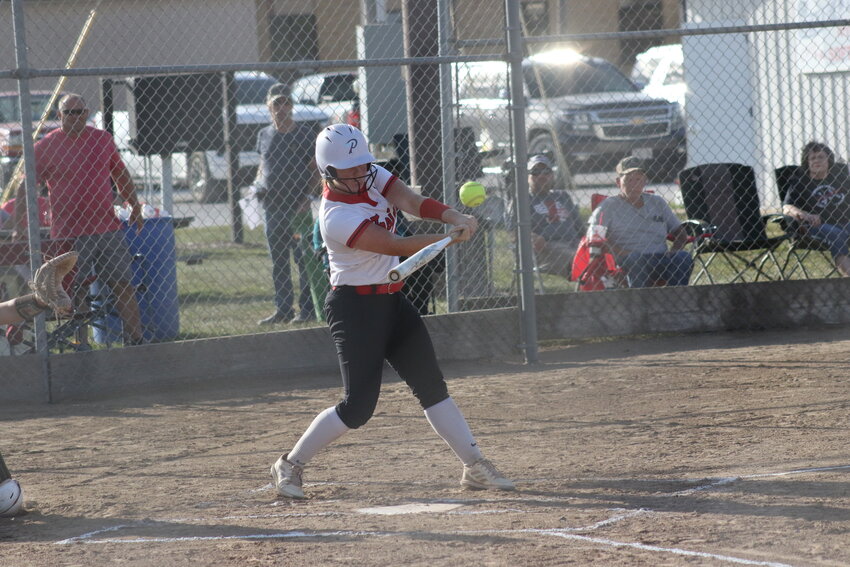 Community R-6 senior Amy McCurdy hits a ball into the outfield for a base hit against Cairo on Monday at home in Laddonia.