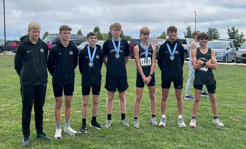 The second-place Centralia High School boys cross country team stands with their medals on Saturday during the Father Tolton XC Invitational at Gans Creek Cross Country Course in Columbia.