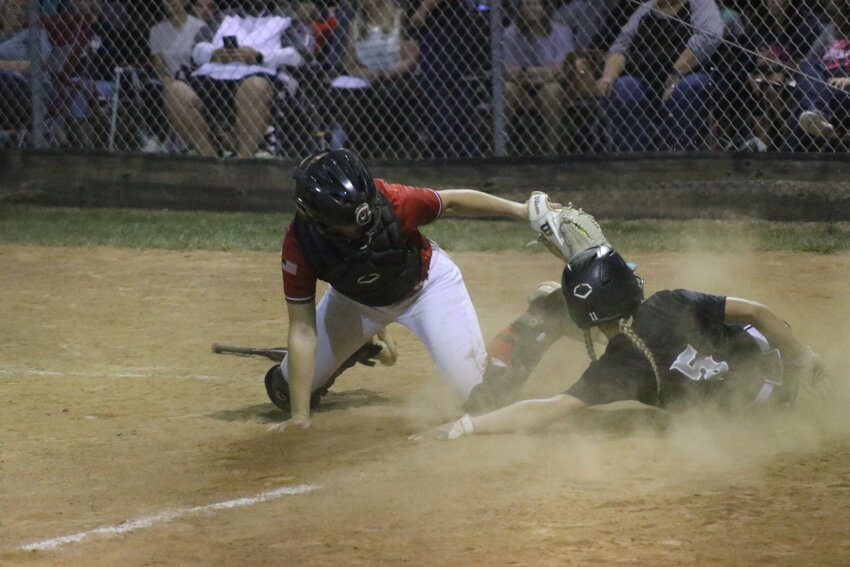 Mexico junior Hannah Loyd tags out a Centralia runner trying to score on Tuesday in Centralia.