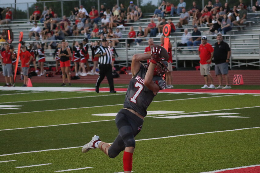 Mexico senior Tyson Carr catches a 31-yard touchdown pass from junior Charlie Fisher on Friday at Hawthorne Heights in Mexico.