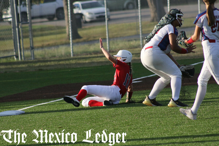 Mexico sophomore Aleigha Henderson slides into third base with one of her two triples on Tuesday against Moberly on Mexico's turf field.