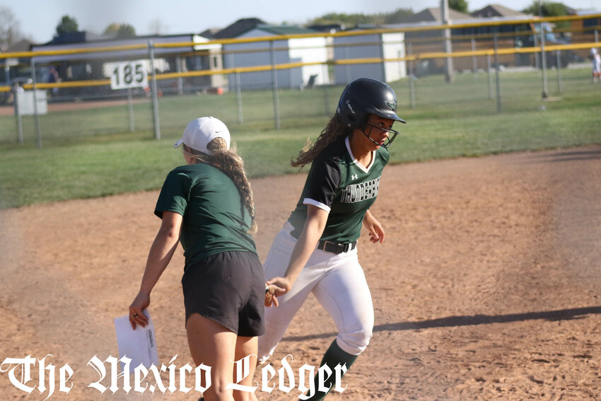 North Callaway junior Kymorie Myers celebrates with head coach Mariah McKee after hitting a home run against Smith-Cotton in the third-place game of the Centralia Invitational on Saturday.