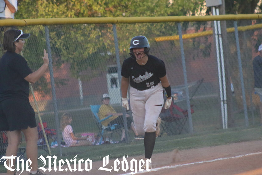 Centralia junior Cora King shouts toward her teammates after hitting a home run against Hallsville during the Centralia Invitational championship game on Saturday.