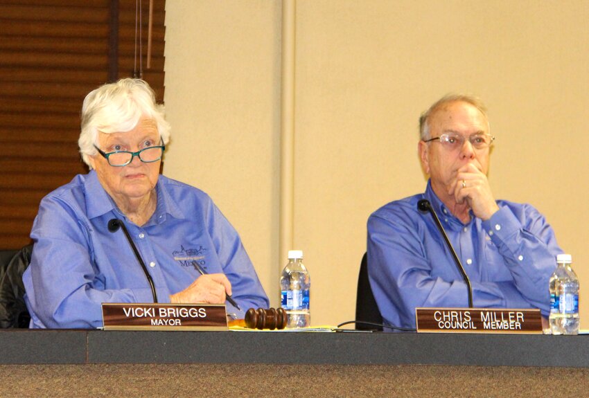 Mexico Mayor Vicki Briggs and Chris Miller listen during a presentation at the city council meeting Feb. 24.