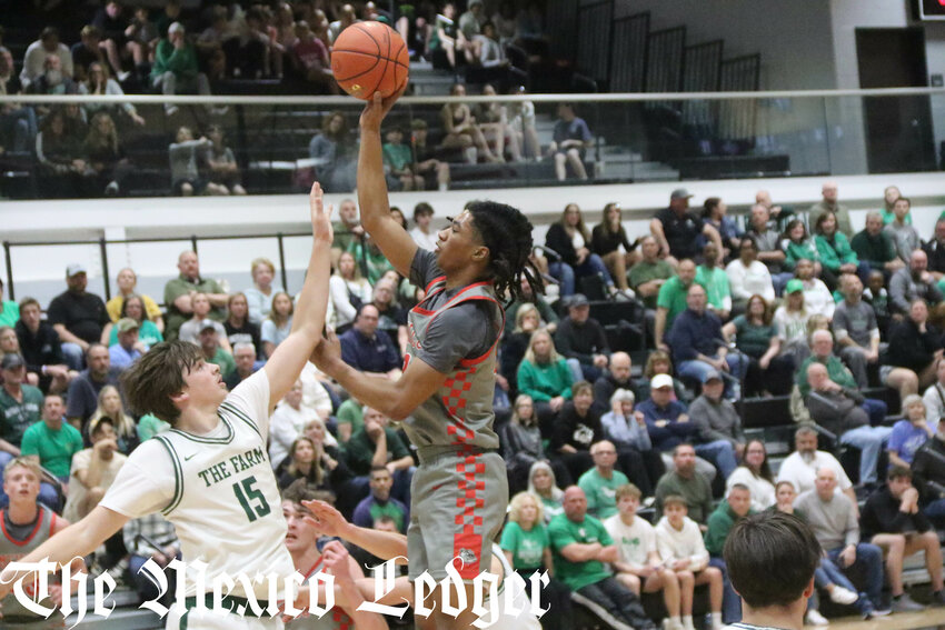 Mexico senior PJ Perkins floats a shot over Orchard Farm on Monday in a Class 4 sectional game at Orchard Farm in St. Charles.