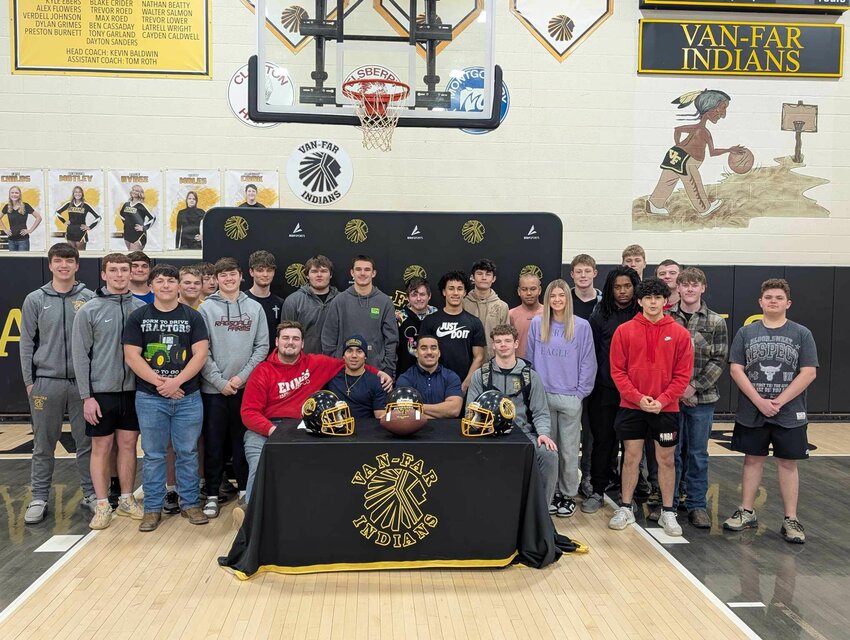 Van-Far senior twin brothers Malik and Tyson Douglas are surrounded by their teammates two weeks ago during their signing ceremony to play football for Graceland University in Iowa.