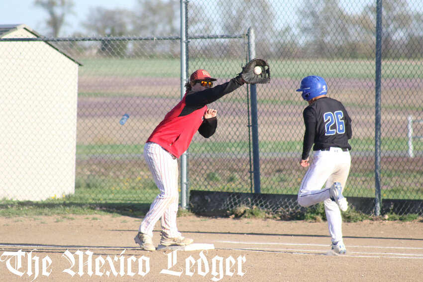 Community R-6 junior Kaiden Erdel catches a throw at first base in an earlier home game this season.
