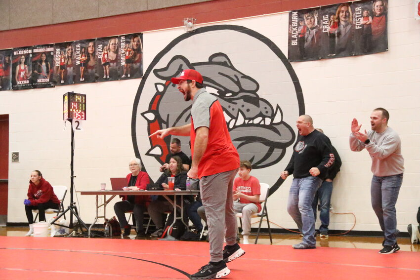 Jake Vitale cheers on Mexico wrestlers at the district tournament in Mexico this year. The Mexico alumnus Vitale was promoted from an assistant to the boys wrestling program's next head coach last week.
