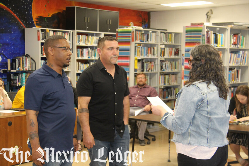 Dustin Holt and Bryan Evans are sworn in as members of the Van-Far R-I school board on April 17.